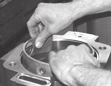 To drive out the shaft seal, take a round head punch and carefully tap out from the cover side of the pump. Remove the shaft seal. Figure 14. 15.