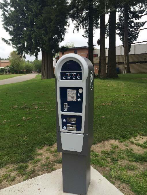 Bremerton currently uses multi-space pay stations by T2 Systems to serve some parking areas. A single station can typically cover 10-15 parking stalls. Exhibit 3.