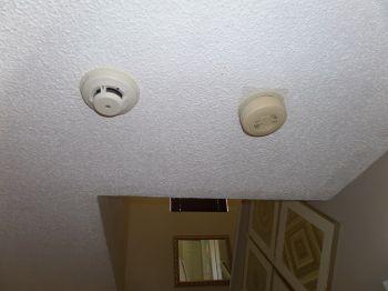 antiquated smoke detectors with newer models.