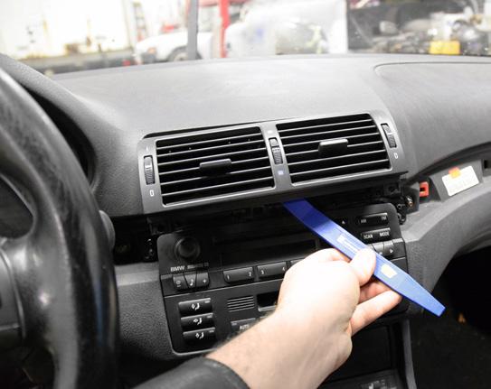 Use a non-marring trim removal tool to gently pry on the RH trim panel and remove it as