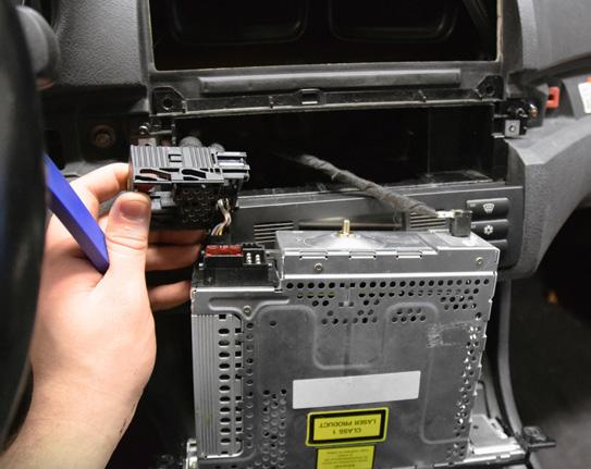 Remove the two other connectors from the back of the radio.