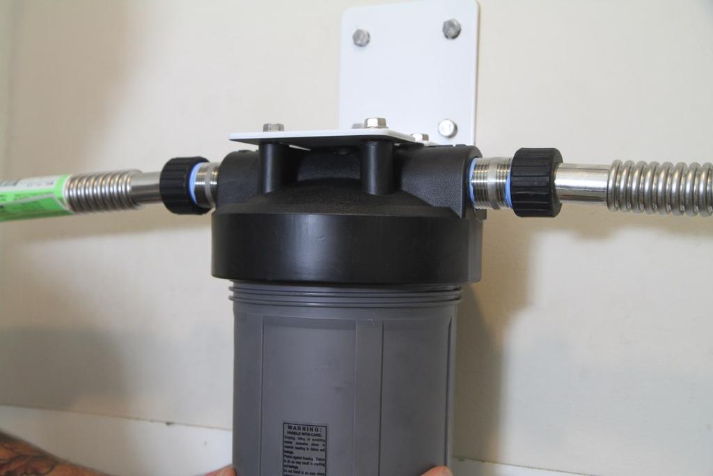 The filter housing cap has a coupling that will accept the o-ringed nipple on top of the  Install