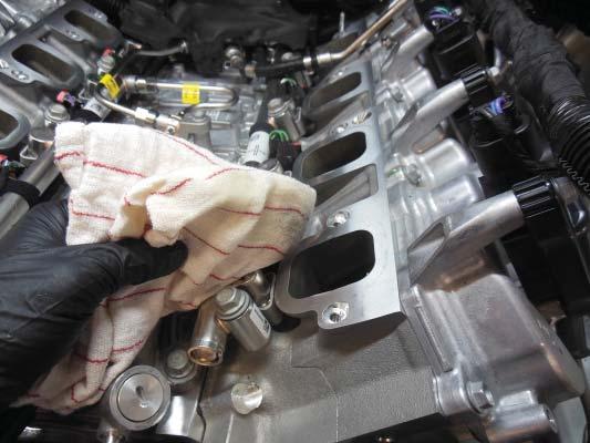 Pull the coil harnesses to the sides to make clearance for supercharger installation.