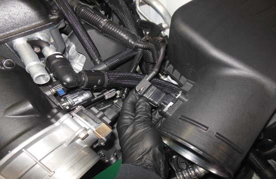 Remove the harness clamp (shown with an arrow) from the OEM air filter box. 163.