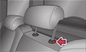 Seats and Stowage 73 Move the head restraint downwards if required by pressing the locking button with one hand in direction of arrow A2 fig.