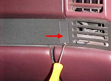 c. Carefully remove the rectangular trim cover next to the passenger side vent