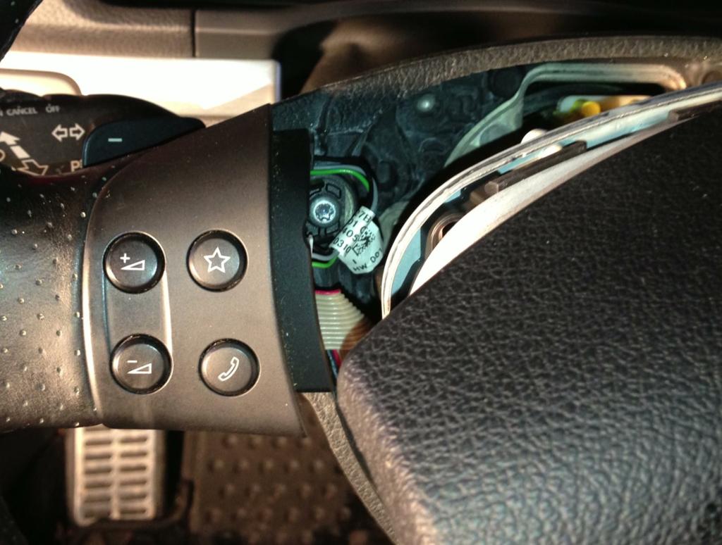 Torx screw securing the steering wheel trim piece.
