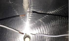 The White Input Wire is the Neutral. The Black or Red Input Wire is Line Voltage Input from 100 277 Volts.