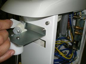 3) Remove the socket cap screws taped to the top of the water system bracket and insert into